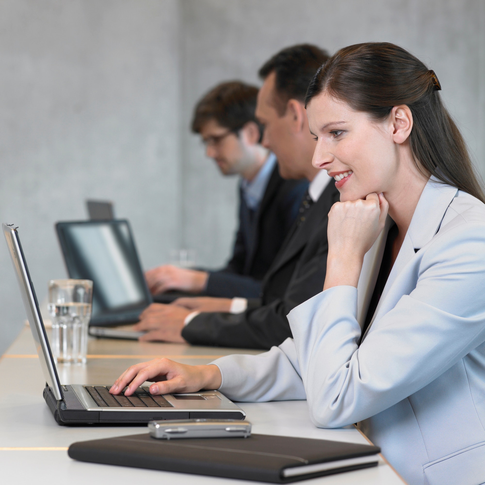 businesswoman-using-laptop-smiling.jpg